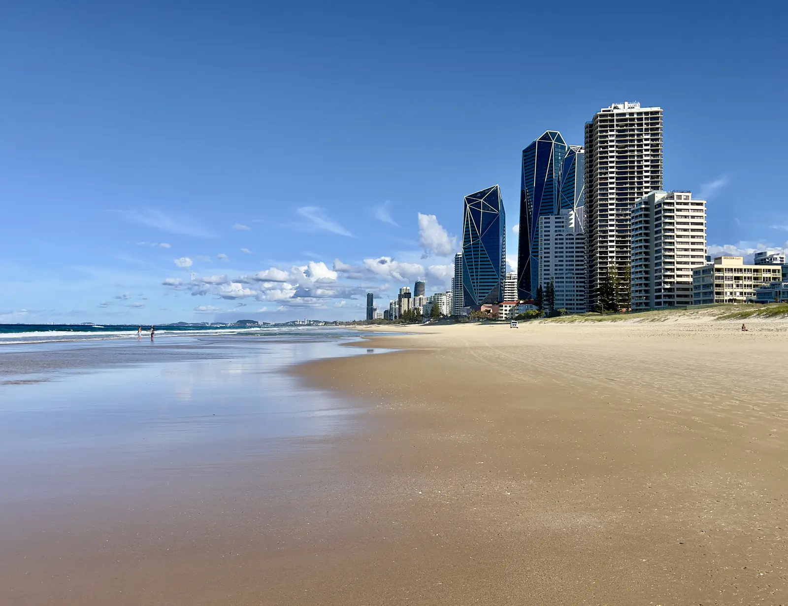 The three Jewel towers beside the beach at Broadbeach on the Gold Coast, seen from the sand.