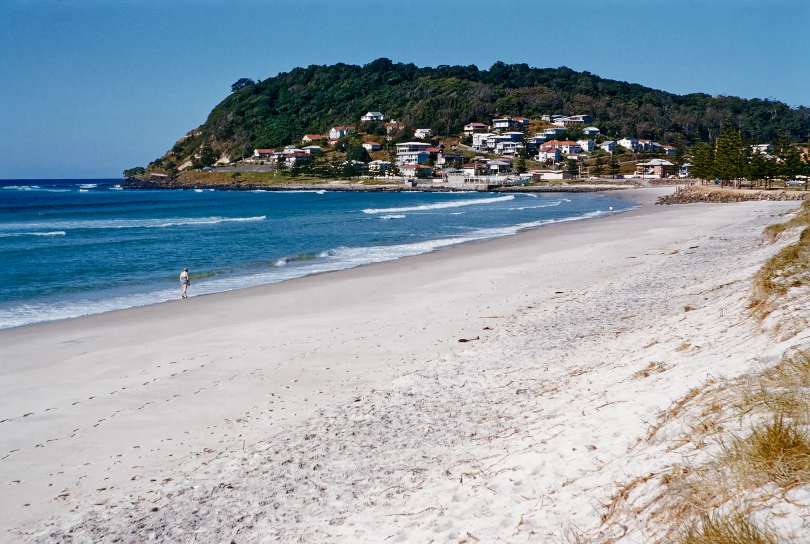 Burleigh Heads Beach looking south toward the rocky headland and Burleigh Head National Park.