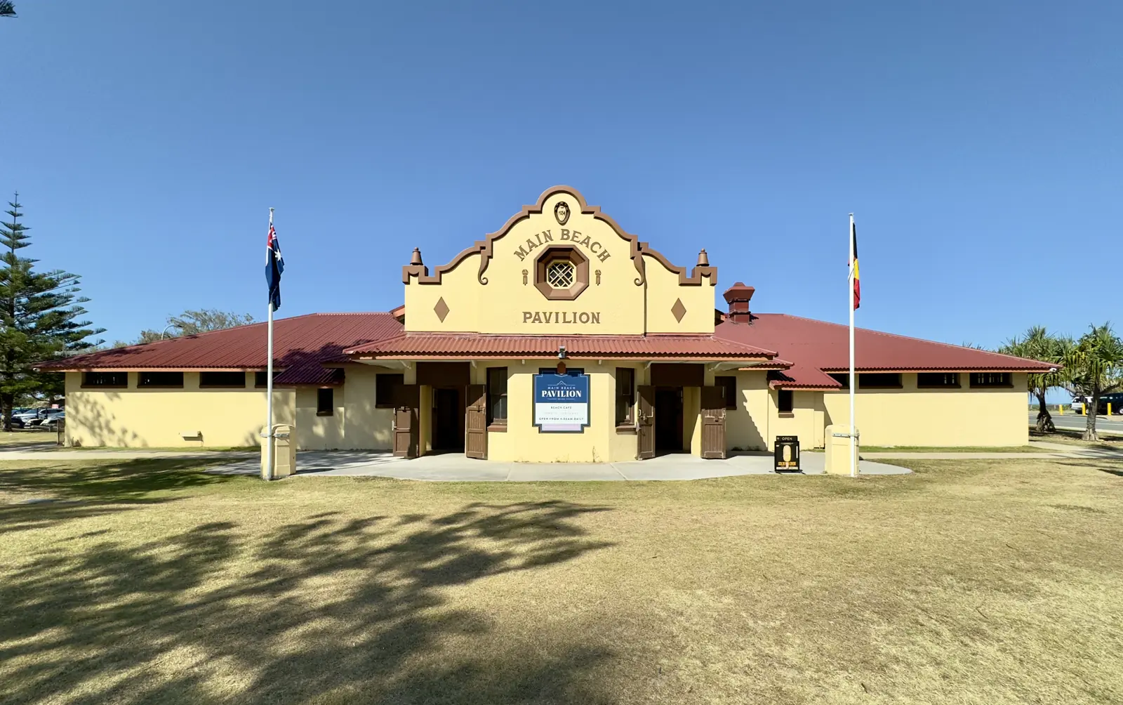 Main Beach Pavilion, the white curved building of the Southport Surf Life Saving Club beside the beach at Main Beach.